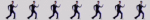 A blinkie gif with five copies of David Byrne from the Once In a Liftime music video, who walk across it in an exaggerated fashion.